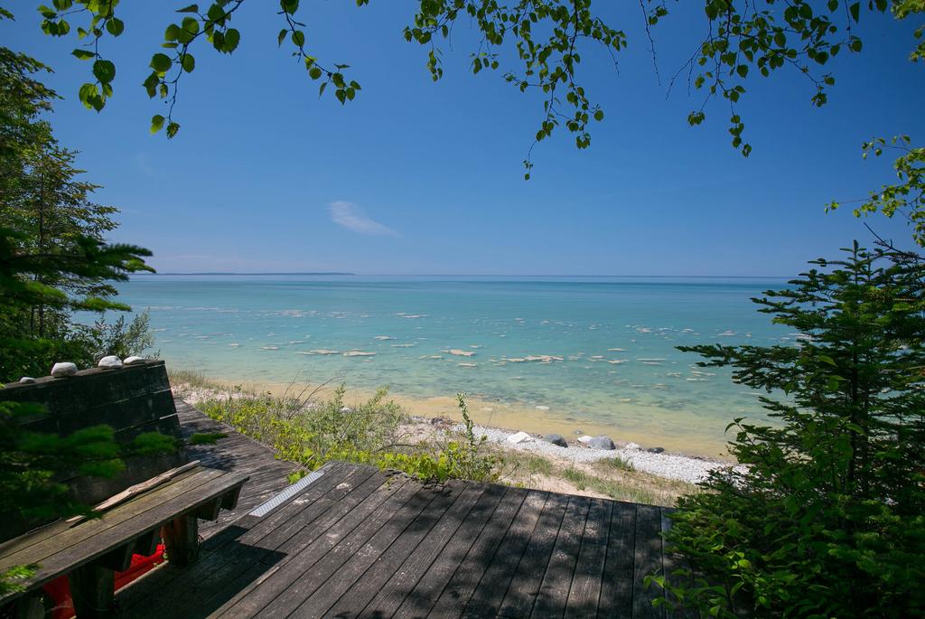 Unparalled, panoramic views of beautiful Lake Michigan, are enjoyed from this light-filled home in The