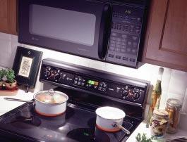 lighting. The GE SpacemakerXL Microwave Oven can be placed at eye-level between the cooktop and kitchen cabinet, providing more counter space.