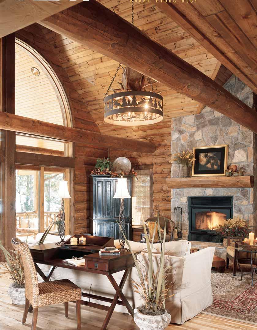 Walk on the Wild Side Glorious lake views remind guests that the home s setting is worth the trek from the city. Half logs top the windows, giving the space a rustic grandiosity.