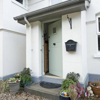 The Property Comprises: Hardwood front door with glazed panel.