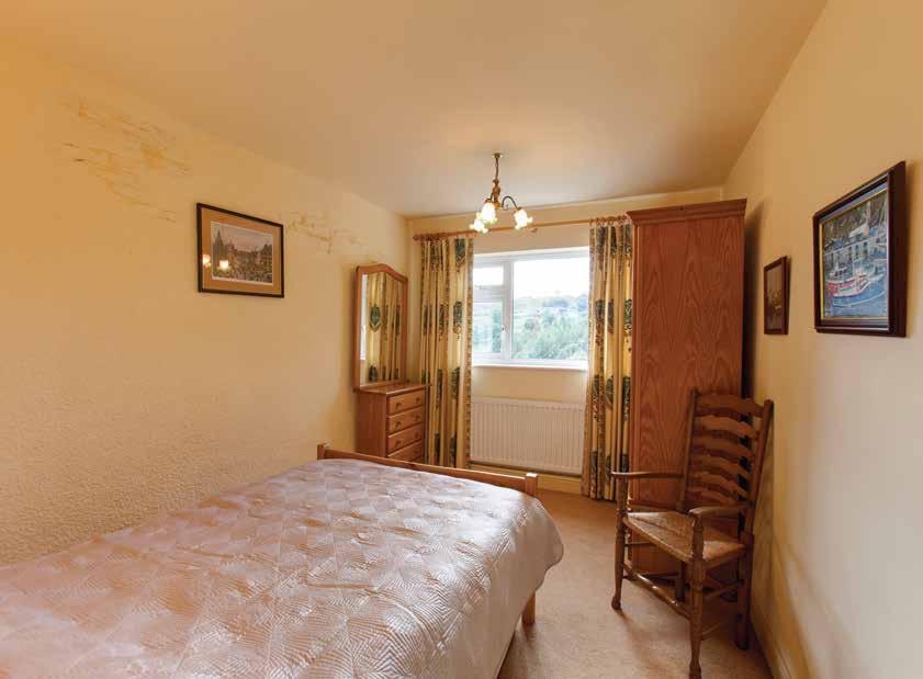 There s a suite in white, which comprises a low level WC, bidet, inset wash hand basin with storage below and a panelled bath with mixer tap and