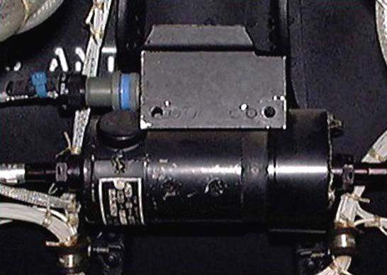 (2) Windshield wiper motor. (a) Mounted above center windshield behind the overhead panel. (b) The windshield wiper motor is controlled by the wiper switch.