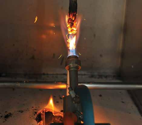 5 meter long samples are harnessed and tied on a ladder inside a chamber, and exposed to flame for 20 or 40 minutes, using a method specified in the standard.