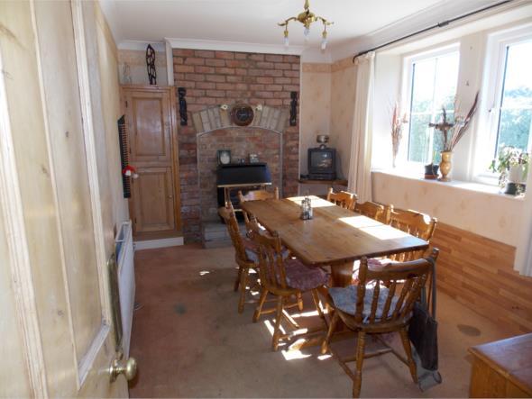 9' (457m x 274m ) Two double glazed windows looking down the rear garden Full height brick chimney breast with a raised open fireplace fitted with a radiant and
