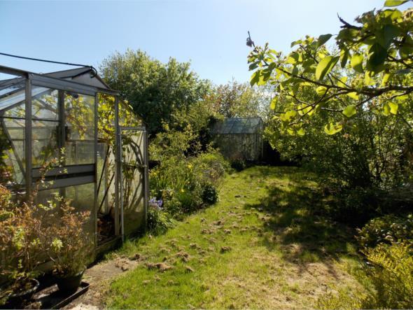 access leads to the sizeable rear garden which is sure to appeal to the keen