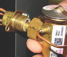 Remove the valve from the box and note the location of the inlet side (threaded male port) and the outlet side (female swivel nut port). III-7.