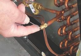 If a Schrader port is NOT present:! A. Install a field-supplied braze-on schrader valve like that shown on the suction line near the intended sensing bulb mounting location.