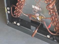 The 24 volt common for the outdoor unit circuitry is connected at the air handler brown wire. (See Fig 11-1.