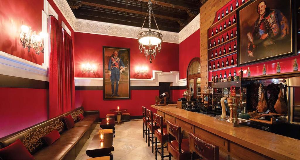 Below:The Bodega Alfonso is a vibrant space that attracts attention for its antiques and art. The wine display wall accentuates the ambience.