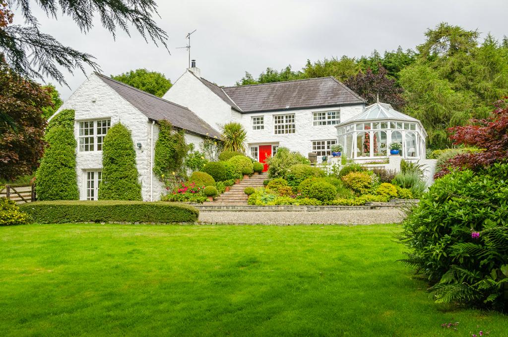 Tucked away in a most delightful sylvan setting just off the main Ballynahinch to Newcastle Road is this charming period Mill House together with a guest cottage.