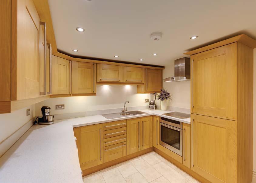 Appliances include a four-ring Neff induction hob, Neff extractor hood, Neff oven, integrated fridge/freezer and having the space/plumbing for an automatic washing machine and a tumble dryer.