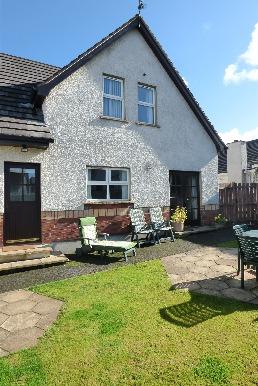 property, garden laid in lawn enclosed by panelled fence, two