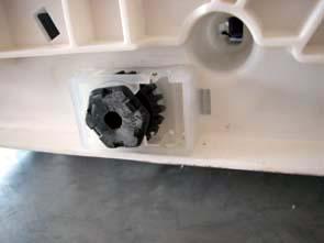 appliance on the rear panel. Remove the regulation screw from the bottom panel (see 1.3b). (c) Using a tool, detach the foot support and slide away from the base. 6.