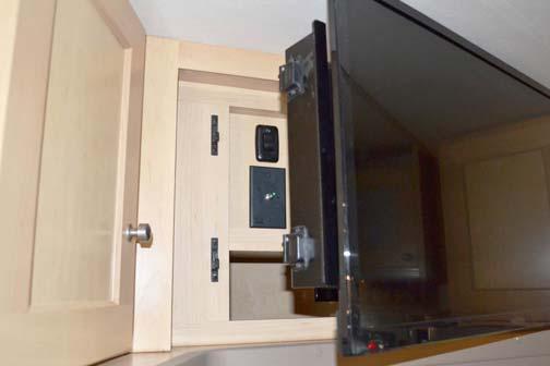 NOTE: The 12-Volt TV Master Power switch must be ON to operate the TV. To Swivel TV Grasp the inboard side of TV and disengage from the wall mounting bracket.
