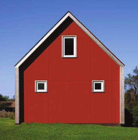 zeroenergy design The home s simple gable-roof structure, emphasized by playful red fiber cement siding on the ends, pays homage to the