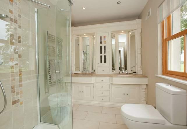 hand shower, low flush WC, hand painted bespoke mirrored dresser unit with marble top