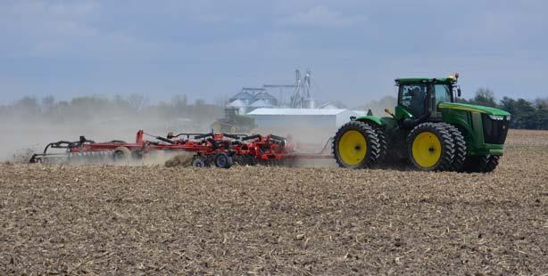 Figure 3.13. Using a disk/ field cultivator to prepare a field with corn residue for planting soybeans. Photo provided by Tom Bechman.
