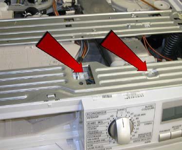 Remove the 2 screws which secure the control panel