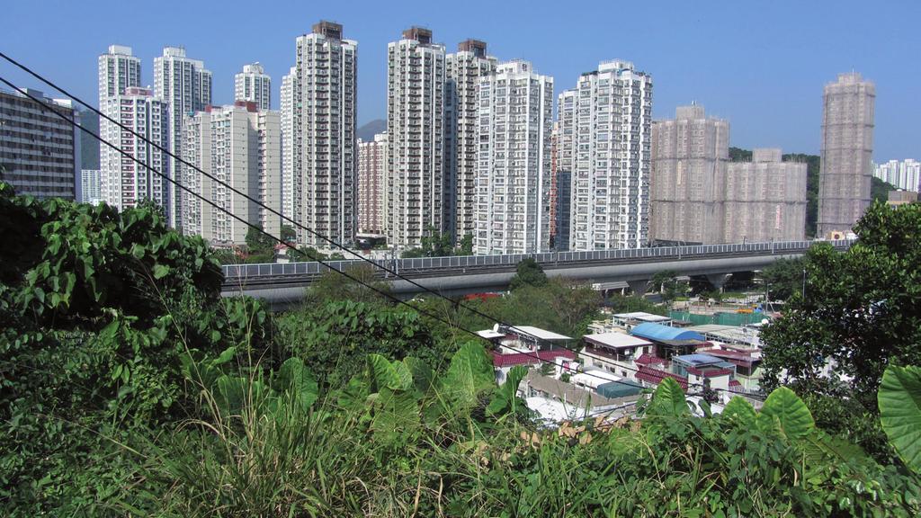 8 TERRY VAN DIJK and GERD WEITKAMP METU JFA Advance Online Figure 2. Sha Tin Wai today is separated from the high-rises by a railway line and sports fields.