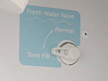 The tank may be filled either by gravity fill or by pressure filling through the city water connection.