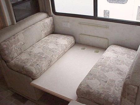 Lift the seats and remove the seat support bumpers to allow the seats to lie flush for use as a bed.