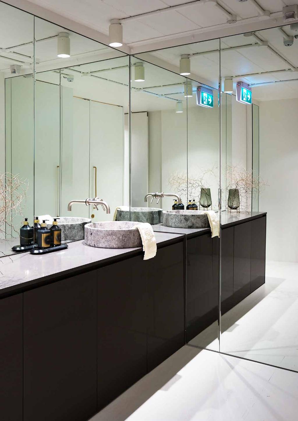 BATHROOM DETAILS With the demanding social lives of the office s occupants in mind, it was deemed altogether necessary that both a shower and a large bathroom area be included, where the staff could