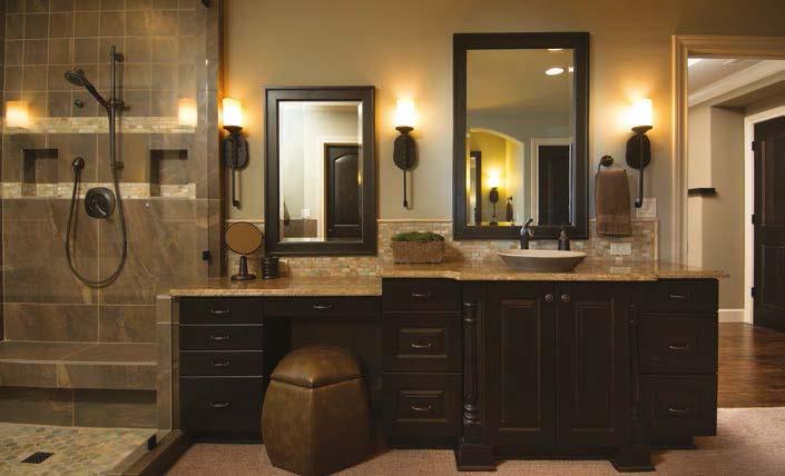 In the bathroom proper, cabinet design and granite counters are repeated from downstairs and Kohler sinks are mated with Delta faucets.