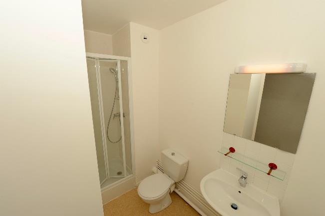 The private bathroom includes a shower and toilet. Certain rooms have modest kitchenettes. These are allocated on a first-come, first-served basis.