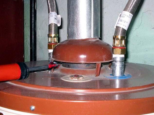 An atmospheric water heater is tested for spillage around the base