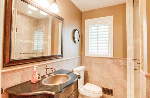 copper sink and matching faucet Framed mirror Linen closet Heated Sun Torch flooring system Tumbled Travertine