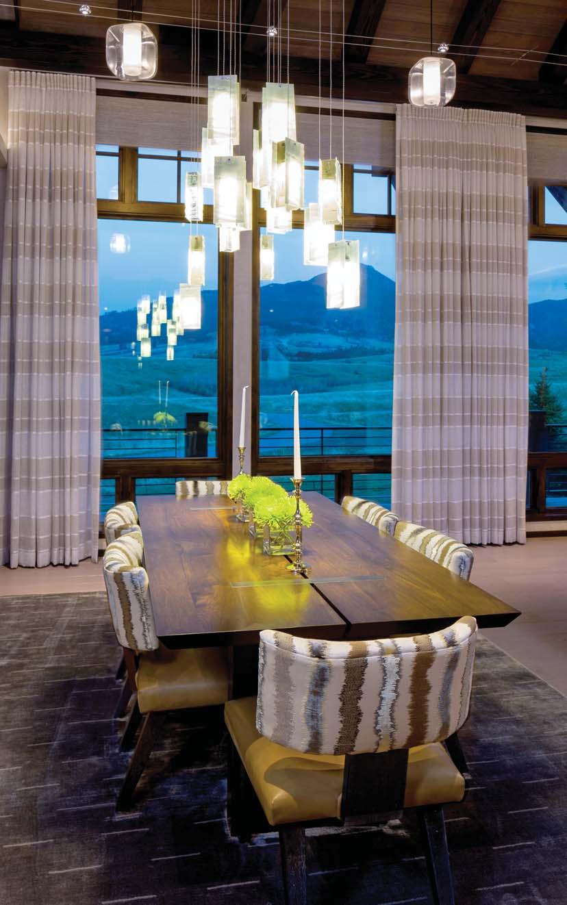 BELOW: A RUSTIC DINING TABLE SURROUNDED BY UNIQUE CHAIRS PROVIDES THE IDEAL PLACE FOR DINING WITH FAMILY AND FRIENDS.