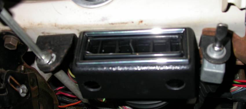 Locate the last of the under dash louver assemblies.