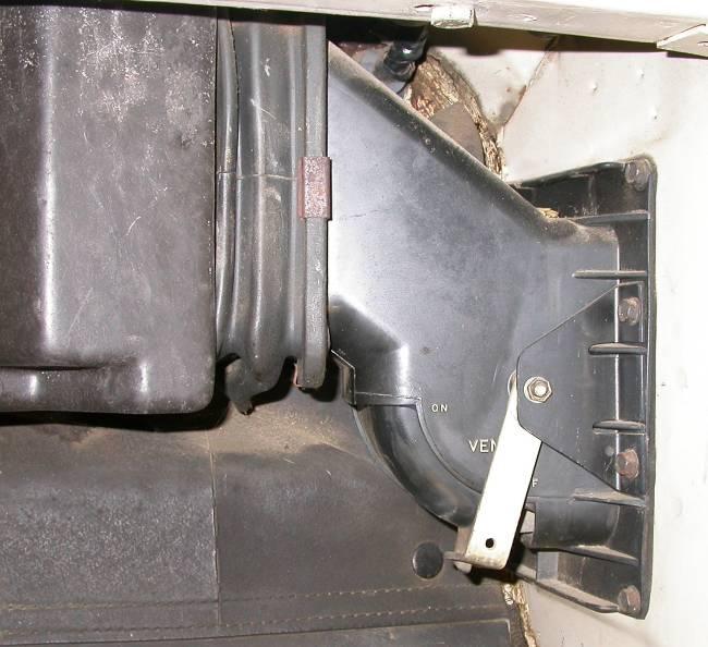 Under glove box opening locate the Fresh Air Inlet duct. Remove screws around the inlet flange.
