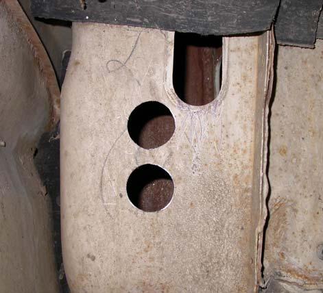 Locate rubber oval plug on the air inlet plenum inside passenger fender well.