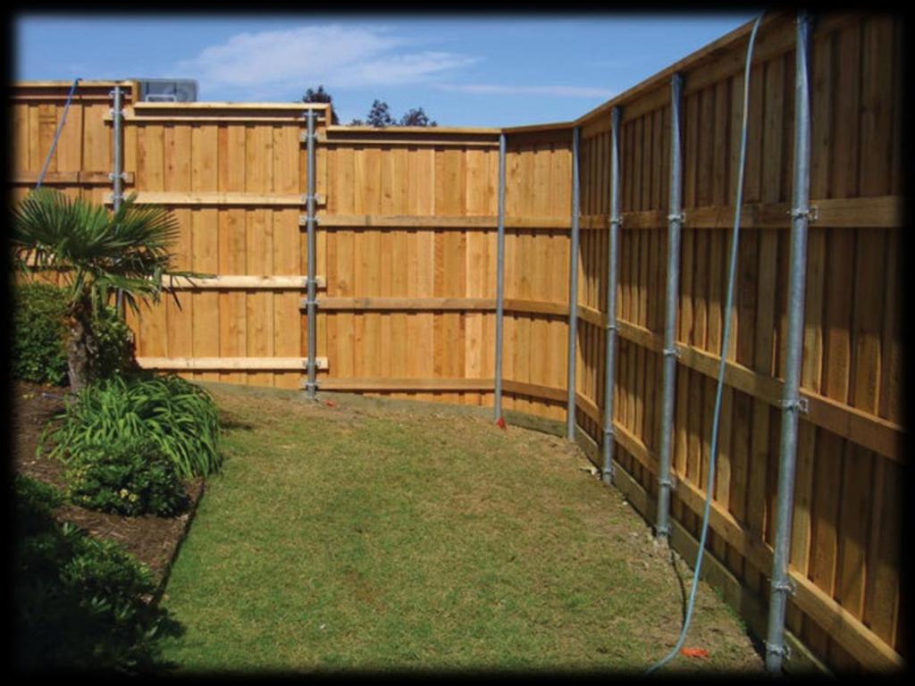 9. A hot tub is surrounded by a wooden fence with metal poles that are within 5 of the water s edge.