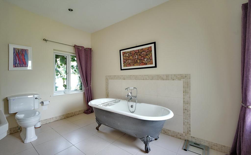BATHROOM: Luxury 4 piece white bathroom suite comprising free