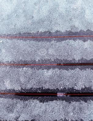 Q. Figure shows solid ice on a car s rear window.