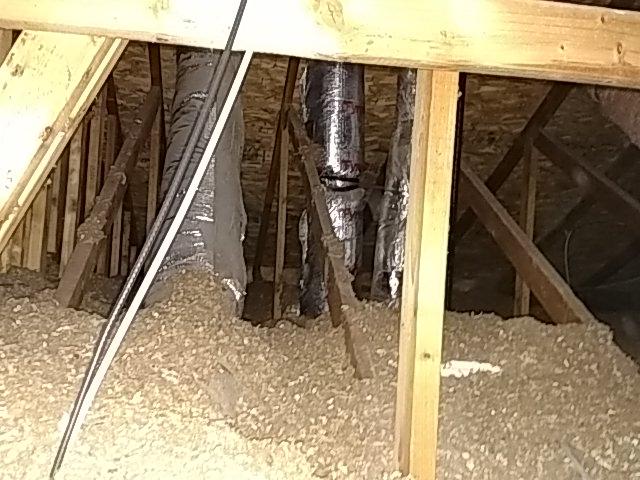 The home inspector shall: Move insulation where readily visible evidence indicates the need to do so; and Move insulation where chimneys penetrate roofs, where plumbing drain/waste pipes penetrate