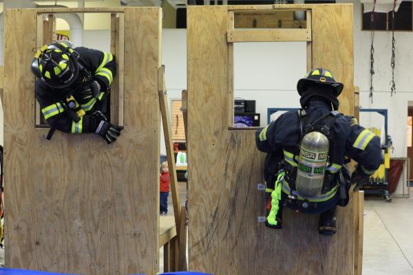 As part of the departments annual training, members practice using their self-rescue bailout kits to simulate bailing out of a second story