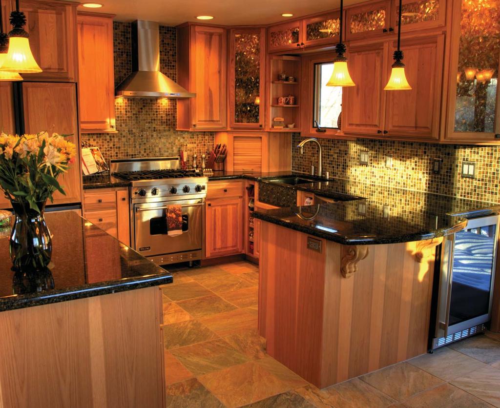 after The new kitchen has a range with stainless trim, a Fisher & Paykel dishwasher, and a GE integrated refrigerator.