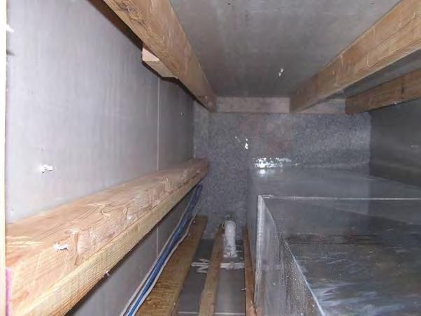 No gypsum was installed at the top of the return duct leaving the duct chase open at the top to the exterior environment.
