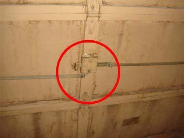 2 (1) Safety: No safety cable was installed inside of the garage door extension springs in all garages.
