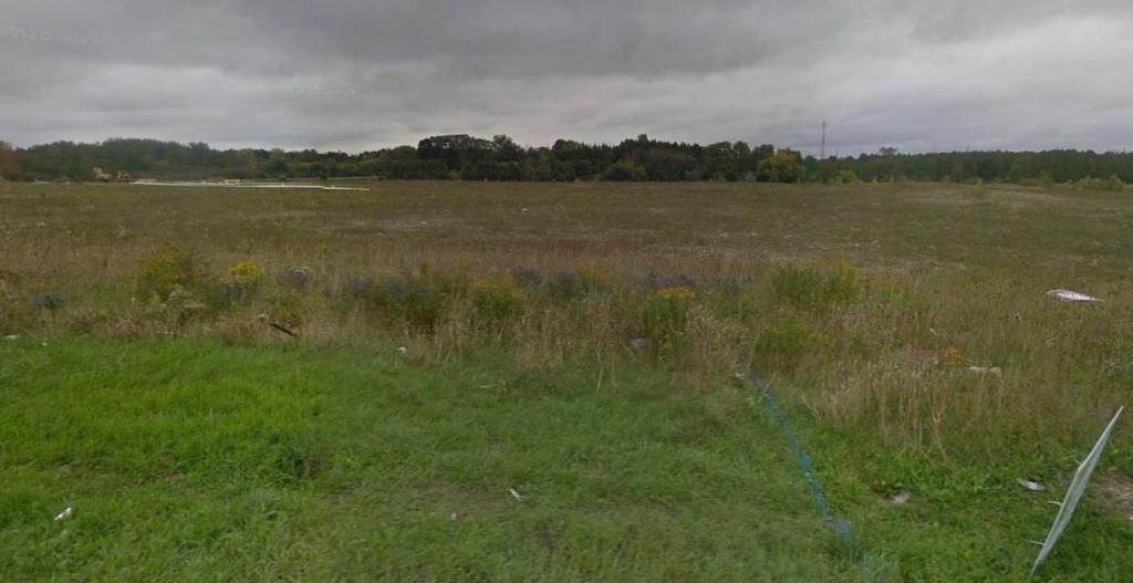 Figure 4: Street level view of floodplain and stormwater management pond (Source; Google Maps) South Edge South of the subject