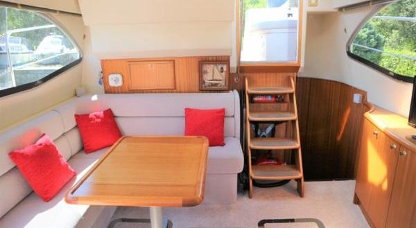 GALLEY A lovely spacious galley with solid surfaces and an abundance of cupboards drawers, perfect for those longer trips away. SALOON Large U shaped sofa with free standing/folding dining table.