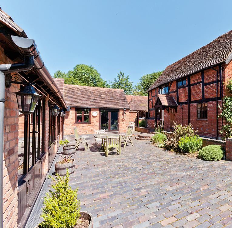 Across the courtyard is the detached converted barn forming attractive self contained ancillary accommodation with cloakroom, large fully fitted kitchen/dining room and sitting room with log burner.