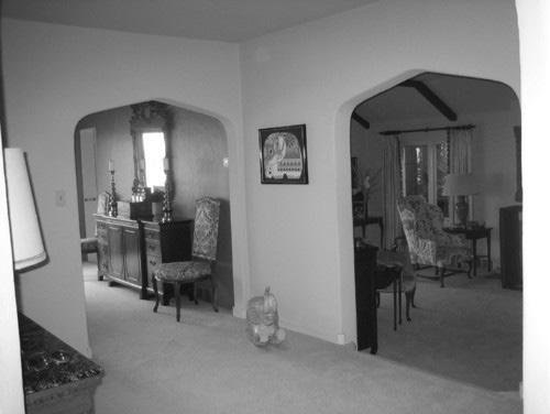 BEFORE: There was nothing dramatic or open about the existing entry hall. Throughout the main floor, there were heavy plaster walls between the entry, kitchen, dining room and living room.