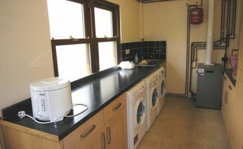 Recently fitted with a range of wooden base and wall units with granite effect worksurfaces over incorporating 1Ã Â½ bowl stainless steel sink and drainer unit with waste disposal system, and tiled