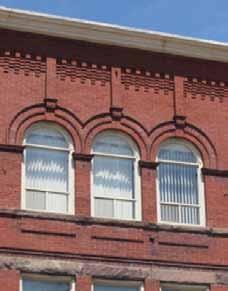 Corbel Lintel Windows with rounded tops and decorative lintels.