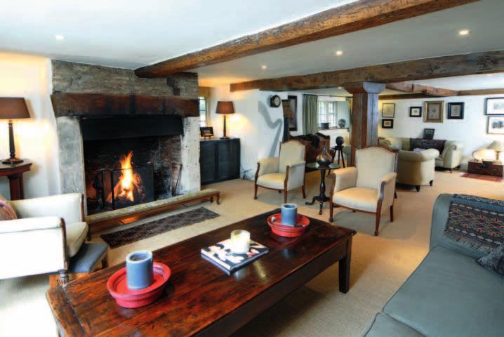 The earlier part features fine inglenook fireplaces, stone mullion windows and some excellent exposed beams as well as a stone flagged floor in the dining room.