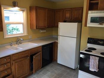 1. Kitchen Room Kitchen Walls and ceilings appear in good condition overall. Flooring is vinyl. Heat register present.